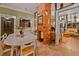 Inviting dining room featuring a decorative brick fireplace, an art collection, and hardwood flooring at 3532 South Fulton Ave, Hapeville, GA 30354