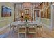 Elegant dining room with oval table and brick accent wall at 3532 South Fulton Ave, Hapeville, GA 30354