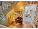 Cozy hallway with floral wallpaper, wooden floors, and a view into the inviting living room at 3532 South Fulton Ave, Hapeville, GA 30354