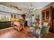 Bright eat-in kitchen featuring stainless appliances, an island with a wood top, a hutch, and a glass table at 3532 South Fulton Ave, Hapeville, GA 30354