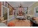 Elegant living room with a brick feature, view of the staircase, and vintage furnishings at 3532 South Fulton Ave, Hapeville, GA 30354