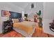 Bright main bedroom with hardwood floors and a high ceiling featuring a skylight at 3532 South Fulton Ave, Hapeville, GA 30354