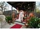 A decorated outdoor reception area includes flowers, candles, and furniture at 3532 South Fulton Ave, Hapeville, GA 30354