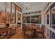 Bright sunroom with a wooden table and chairs, providing plenty of natural light at 3532 South Fulton Ave, Hapeville, GA 30354