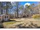 Spacious backyard with shed and deck, offering ample outdoor space at 430 Flowering Trl, Grayson, GA 30017