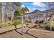 Extended deck with pergola, ideal for relaxation and gatherings at 430 Flowering Trl, Grayson, GA 30017