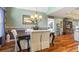 Formal dining room with hardwood floors, a chandelier, and a neutral color scheme at 430 Flowering Trl, Grayson, GA 30017