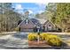 Beautiful ranch home with a large front yard, two-car garage, and mature landscaping at 430 Flowering Trl, Grayson, GA 30017