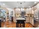 Modern kitchen with granite countertops and hardwood floors at 430 Flowering Trl, Grayson, GA 30017