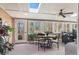 Sun-drenched sunroom with skylights, a ceiling fan, and access to the backyard at 430 Flowering Trl, Grayson, GA 30017