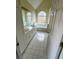 Main bathroom with double vanity, soaking tub, and large window at 733 Exchange Mill, Dacula, GA 30019