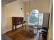 Dining room features hardwood floors and large window at 733 Exchange Mill, Dacula, GA 30019