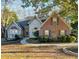 Brick and shingle two-story house with landscaping and walkway at 733 Exchange Mill, Dacula, GA 30019