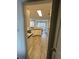 View of kitchen with light wood flooring and white cabinets at 733 Exchange Mill, Dacula, GA 30019