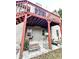 Covered patio with seating area under the deck at 733 Exchange Mill, Dacula, GA 30019