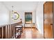 Upper hallway with stained wood railings, a window seat, and hardwood floor at 1105 Sallete Ct, Marietta, GA 30066