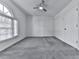 Spacious bedroom with large window and plush carpeting at 1699 Paddlewheel Dr, Marietta, GA 30062