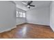 Spacious bedroom with wood flooring and ceiling fan at 1699 Paddlewheel Dr, Marietta, GA 30062