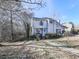 Two-story house with gray siding, walkway, and landscaping at 1699 Paddlewheel Dr, Marietta, GA 30062