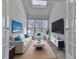 Cozy Gathering room with skylight, comfy seating, and large TV at 1699 Paddlewheel Dr, Marietta, GA 30062