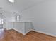Upstairs hallway with wood flooring and white walls at 1699 Paddlewheel Dr, Marietta, GA 30062