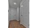 Clean hallway with hardwood floors and white doors at 1699 Paddlewheel Dr, Marietta, GA 30062