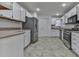 Galley kitchen with stainless steel appliances and white cabinets at 1699 Paddlewheel Dr, Marietta, GA 30062
