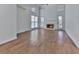 Spacious living room with hardwood floors, fireplace, and large windows at 1699 Paddlewheel Dr, Marietta, GA 30062