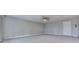Bright living room features neutral paint, ceiling fan, and door perfect for relaxing or entertaining guests at 1699 Paddlewheel Dr, Marietta, GA 30062