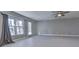 Spacious living room features bright natural light, neutral paint, and ceiling fan perfect for relaxation or entertainment at 1699 Paddlewheel Dr, Marietta, GA 30062