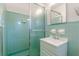 Small bathroom with teal tile and shower at 1899 King Alfred Dr, Atlanta, GA 30331