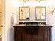 Bathroom with double vanity, dark wood cabinets, and large mirrors at 2499 Peachtree Ne Rd # 504, Atlanta, GA 30305