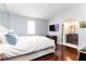 Main bedroom with ensuite bathroom, hardwood floors and large TV at 2499 Peachtree Ne Rd # 504, Atlanta, GA 30305
