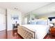 Spacious primary bedroom with hardwood floors and large mirror at 2499 Peachtree Ne Rd # 504, Atlanta, GA 30305
