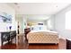 Bright bedroom with hardwood floors, large mirror, and ensuite bathroom at 2499 Peachtree Ne Rd # 504, Atlanta, GA 30305