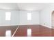 Bright bedroom with hardwood floors, neutral walls and a large wall mirror at 2499 Peachtree Ne Rd # 504, Atlanta, GA 30305