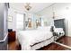 Bedroom with hardwood floors, large mirror, and ample closet space at 2499 Peachtree Ne Rd # 504, Atlanta, GA 30305
