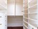Custom closet with white shelving, drawers, and gold hardware accents at 2499 Peachtree Ne Rd # 504, Atlanta, GA 30305