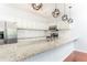 Kitchen featuring stainless steel appliances, granite countertops, and white cabinetry at 2499 Peachtree Ne Rd # 504, Atlanta, GA 30305