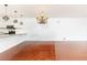 Bright living room with hardwood floors adjacent to an open kitchen with granite countertops at 2499 Peachtree Ne Rd # 504, Atlanta, GA 30305