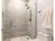 Large shower with gray tile and glass enclosure at 2499 Peachtree Ne Rd # 504, Atlanta, GA 30305