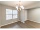 Bright dining room with hardwood floors and a chandelier at 1187 Warm Spring Ct, Hampton, GA 30228