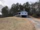 Charming raised home with a front yard and a wooded backdrop at 3991 Dabbs Bridge Rd, Acworth, GA 30101