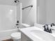Bathroom with a toilet, bathtub, shower, sink and mirror at 5030 Mundy Dr, Cumming, GA 30028