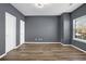 Bedroom with hardwood floors, gray walls and a window at 5030 Mundy Dr, Cumming, GA 30028
