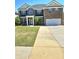 Charming two-story brick home with well-maintained lawn and a two-car garage at 5030 Mundy Dr, Cumming, GA 30028
