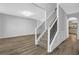 Inviting foyer with staircase, hardwood floors, and neutral paint at 5030 Mundy Dr, Cumming, GA 30028