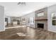Spacious living room featuring a fireplace and hardwood floors at 5030 Mundy Dr, Cumming, GA 30028