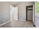 Bedroom with gray walls, carpet, and a closet at 516 Fairlane Nw Cir, Atlanta, GA 30331
