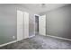 Bedroom with gray walls, carpet, and double doors at 516 Fairlane Nw Cir, Atlanta, GA 30331